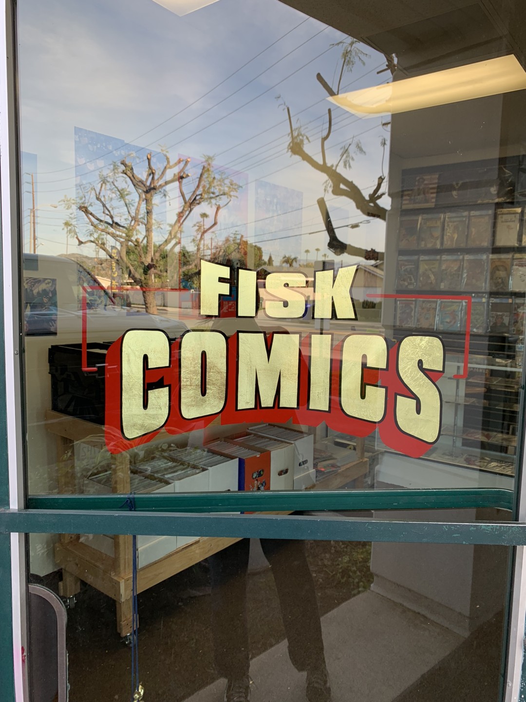 Fisk Comics gold leaf hand painted letterin on glass window